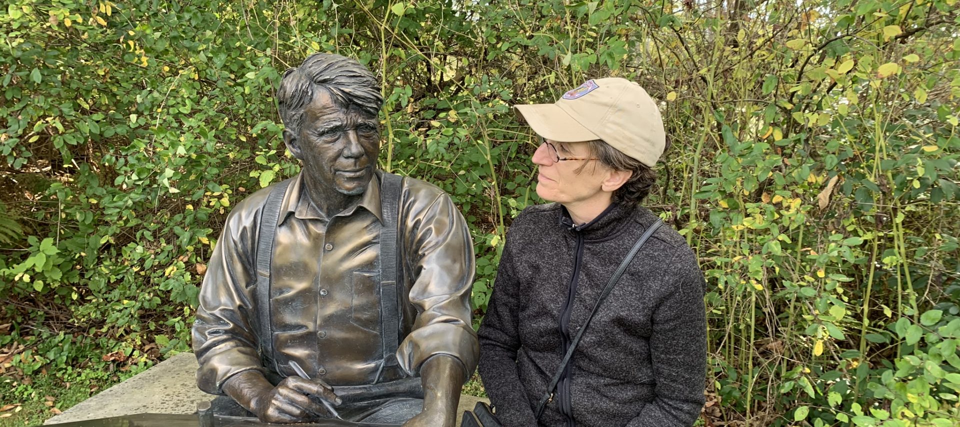 Statue of Robert Frost with MaryAnn sitting next to statute