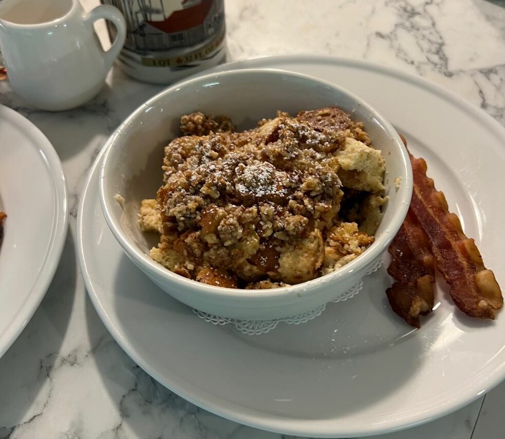 Pecan Crumble Baked French toast for breakfast in bowls with Vermont Maple syrup mixed with Village Bourbon