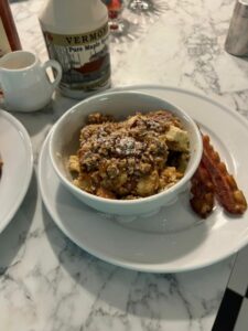 Pecan Crumble Baked French toast for breakfast in bowls with Vermont Maple syrup mixed with Village Bourbon