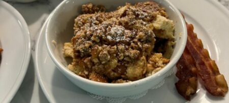 Pecan Crumble Baked French toast for breakfast in bowls with Vermont Maple syrup mixed with Village Bourbon