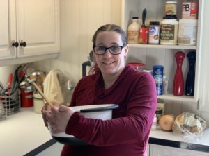 Candi holding white mixing bowl