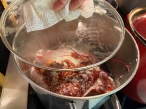 Lobsters steaming in the pot